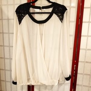 Black and white sheer long sleeve blouse. Wrap front.